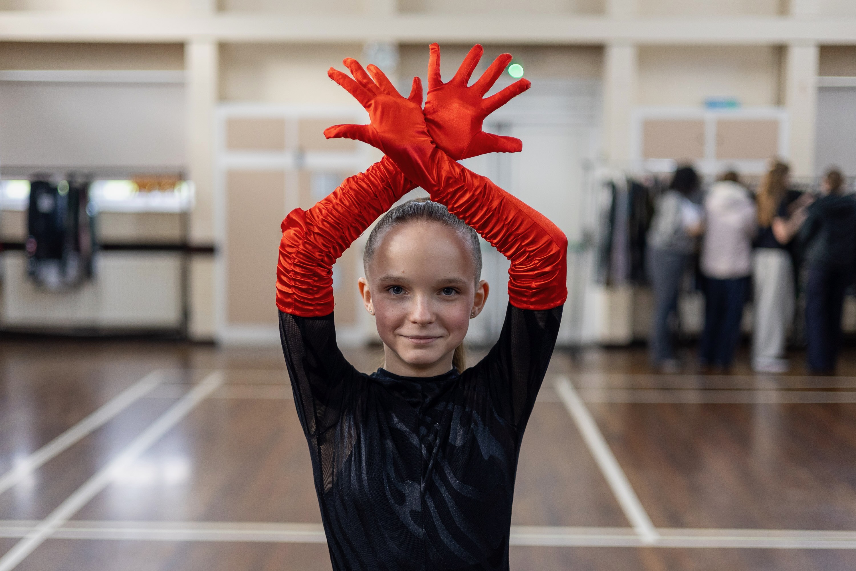Studio portrait of dancer in red gloves